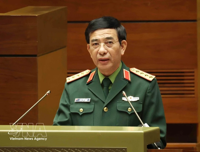 中央政治局委员、中央军委副书记、国防部长潘文江大将在会议上作报告。图自越通社