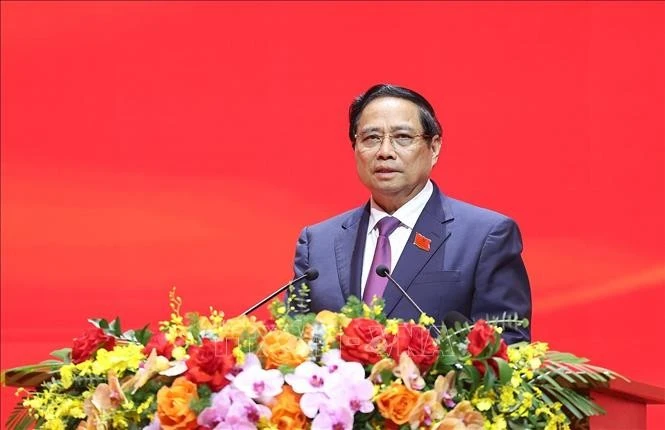 政府总理范明政。图自越通社