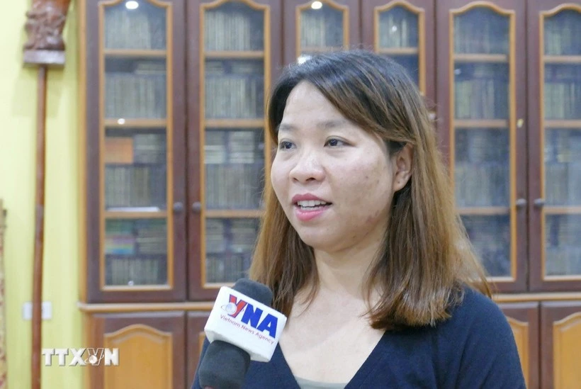 老挝万象越南人协会办公室主任阮氏秋玄。图自越通社