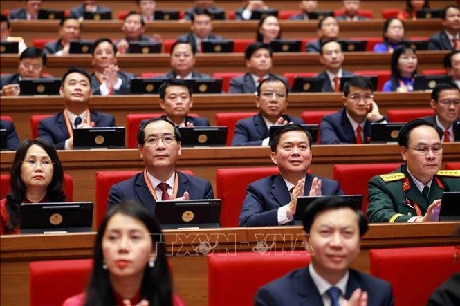 与会代表。图自越通社