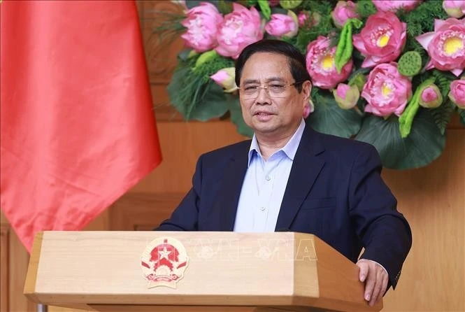 越南政府总理范明政发表讲话。图自越通社